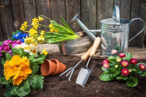 Gardener working in an Ickenham garden preparing tools